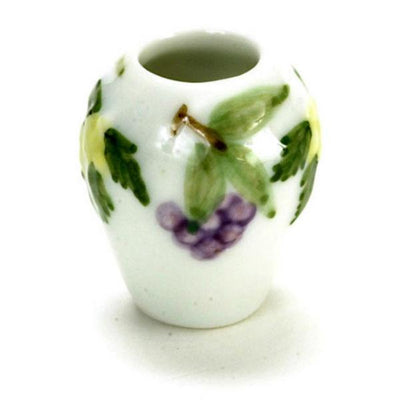 A dollhouse miniature vase with a grape design on it.