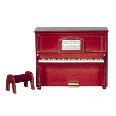A dollhouse furniture piano with a bench and sheet music.